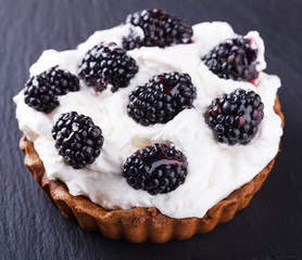 Tartlets with blackberries.selective focus