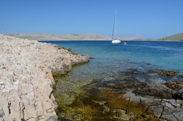 Sailboat anchored in a cove