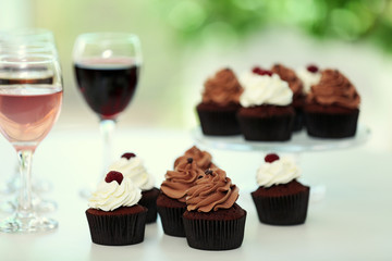Tasting of wine and chocolate cupcakes, close up