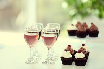 Tasting of wine and chocolate cupcakes, close up