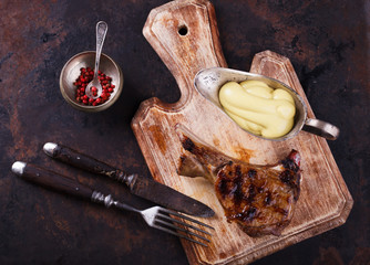 Grilled meat on the bone with mustard sauce.selective focus