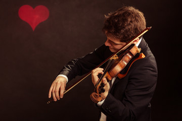 Man violinist playing violin. Classical music art