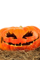 Halloween pumpkin on hay