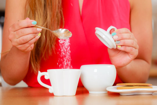 Human Adding Sugar To Tea Or Coffee.