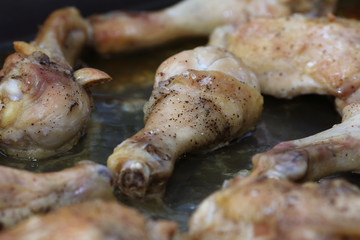 chicken legs in a baking dish close-up