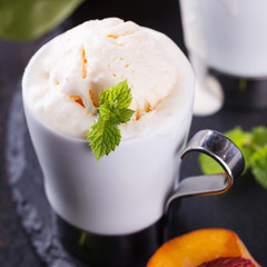 Peach  ice cream with mint, selective focus