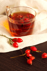 Tea with rosehip on a table. Useful drink for health. Herbal tea. Traditional medicine. 