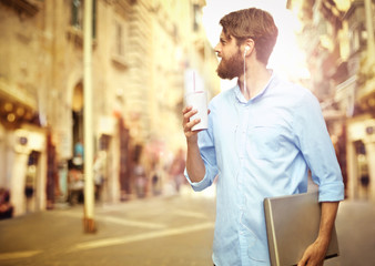 Fototapeta premium Handsome man walking around in the city