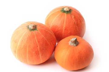 three pumpkins isolated on a white background