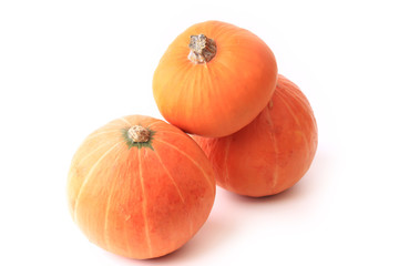 three pumpkins isolated on a white background