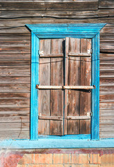 Wooden window with frame painted in blue color, Astrakhan