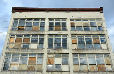 Old abandoned building with boarded up windows