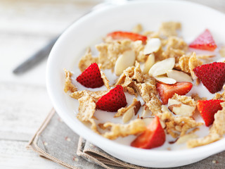bowl of cereal with strawberries and almonds - Powered by Adobe