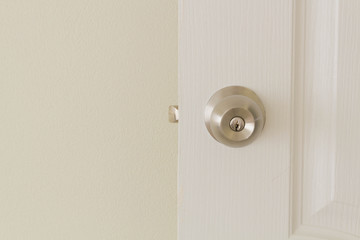 Door lock and key on the white door