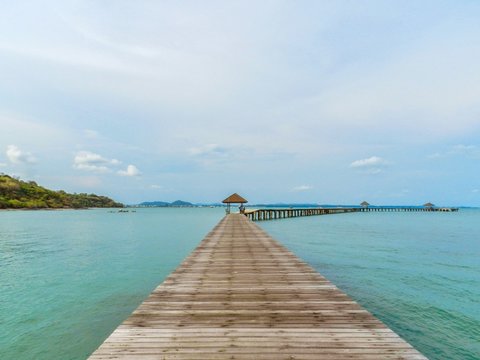The wooden bridge in the sea