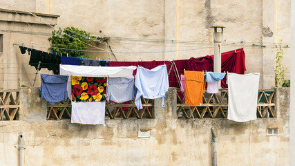 colored clothes drying on the balcony