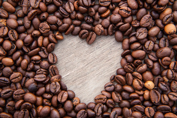 Heart symbol within roasted coffee beans