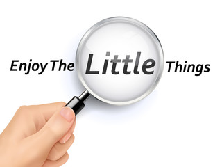 enjoy the little things words showing through magnifying glass