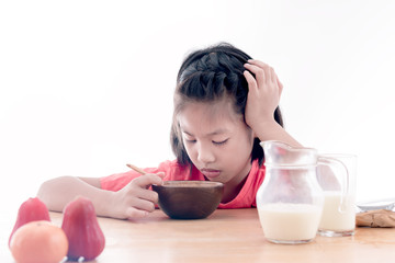 Asian girl don't want to eat his breakfast