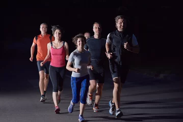 Papier Peint photo Jogging people group jogging at night