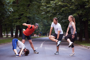 jogging people group stretching