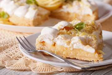 Slice of lemon meringue pie close-up. horizontal
