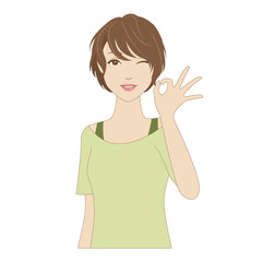 ウィンクしながらOKサインをする若い女性