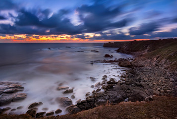 Rocky sunrise. Magnificent sunrise view in the blue hour at the Black sea coast, Bulgaria
