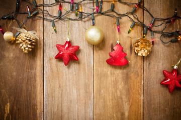Christmas Border - golden baubles, stars, with light on old wood