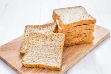 Sliced bread on white wooden table