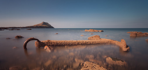 The anchor originally belonged to the Norwegian barque Samuel and is at Worm's head on the Gower peninsular, Swansea.