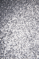 Silver glitter background in defocus abstract