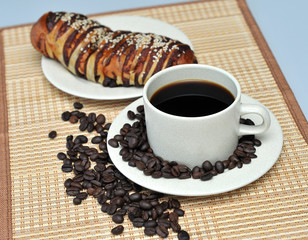 hot coffee with red bean bread on bamboo mat