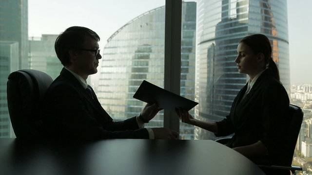 the job of a recruiter conducts an interview with a young
