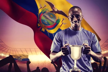 Tuinposter Composite image of portrait of happy athlete holding trophy © vectorfusionart
