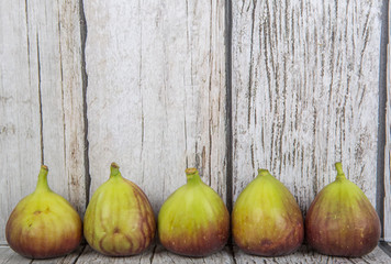 Fig fruits over wooden background