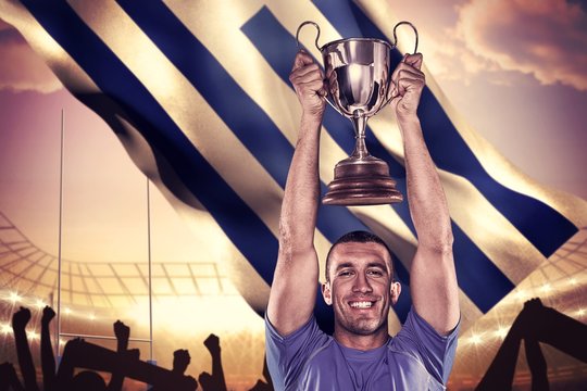 Composite image of portrait of smiling rugby player