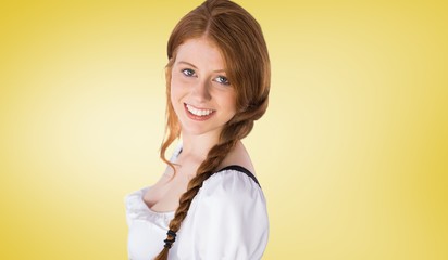 Composite image of oktoberfest girl smiling at camera