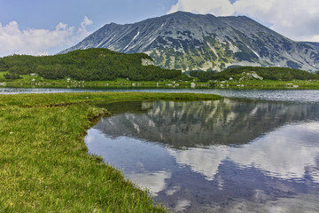 Reflection of Todorka peak in Muratovo lake, Pirin Mountain, Bulgaria