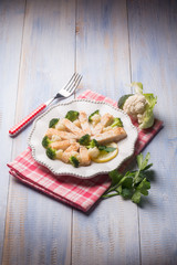 sliced swordfish with broccoli and cauliflower salad