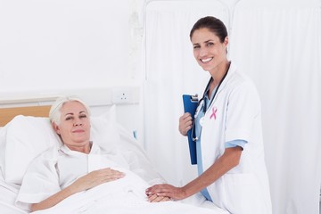 Obraz premium Composite image of pink awareness ribbon