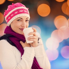 Composite image of woman holding coffee cup