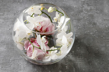 Glass sphere with floral arrangement inside