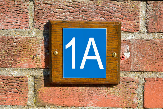 1A House number sign on wall