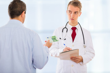 Obraz premium Man offering money to a doctor in order to bribe him to falsify some documents