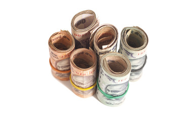 Rolls of Indian rupees isolated on white