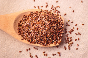 Flax seeds linseed on wooden spoon
