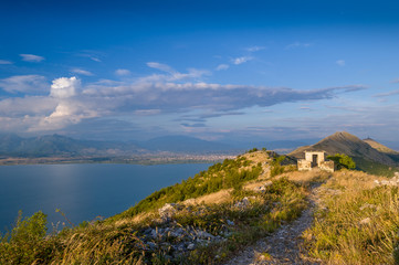 Fototapeta na wymiar Mountain peak, Skadar lake and old watch house on the Montenegro and Albania border. Montenegro.
