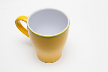 Yellow cup on white background