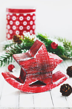 Xmas decoration with red wooden star, fir tree and cones with co